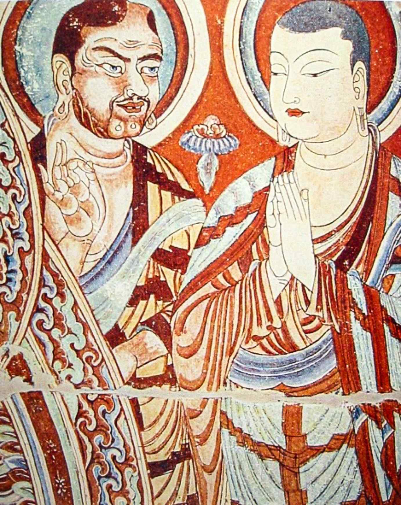 Een blanke Centraal-Aziatische monnik, mogelijk een Indo-Europese Sogdiër of Tochaar, geeft les aan een Oost-Aziatische monnik, misschien een Turkse Oeigoerse of Chinees, op een 9e-eeuws fresco van de Bezeklik Thousand Buddha Caves in de buurt van Turfan, Xinjiang, China.