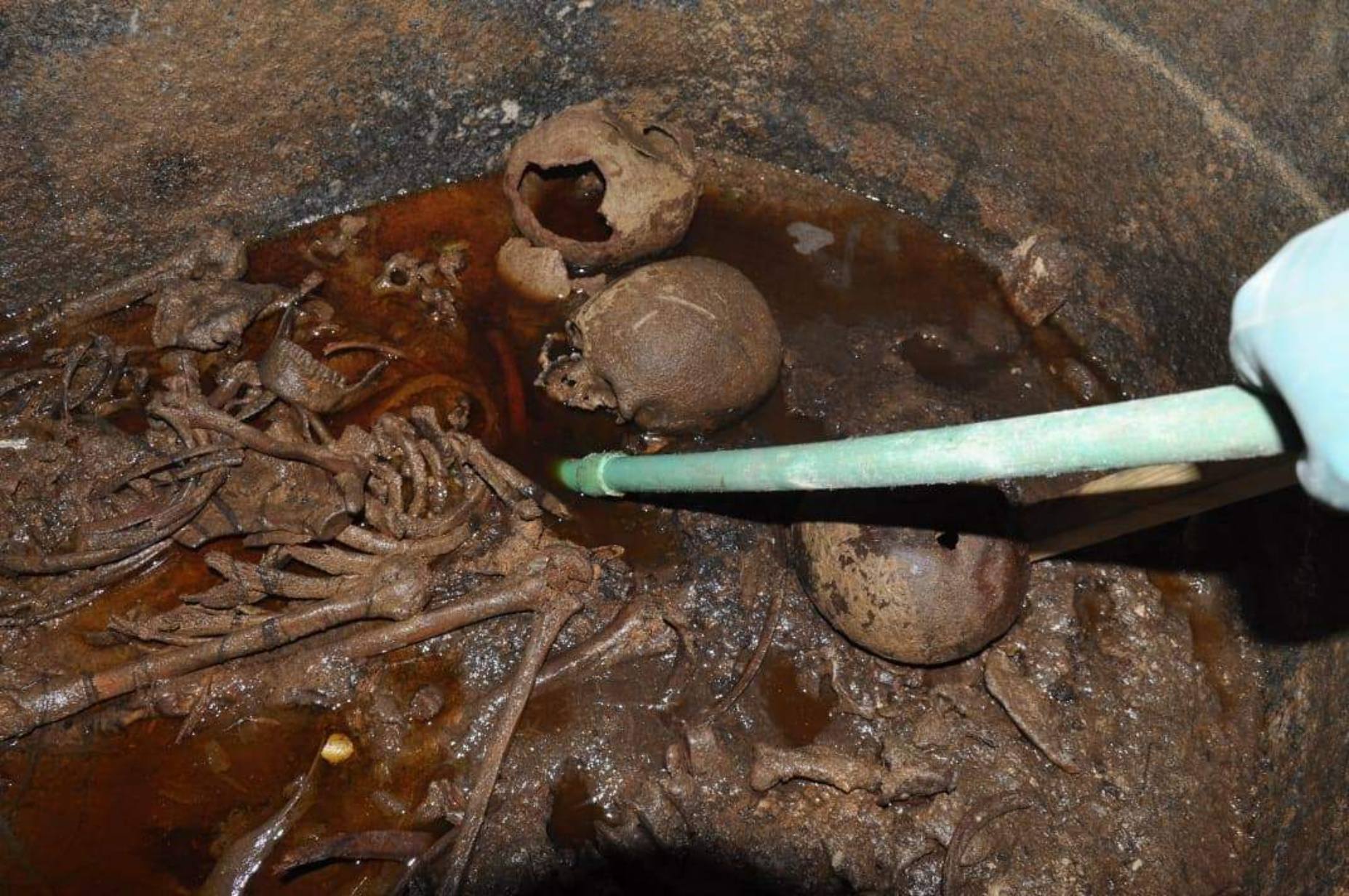 Three skeletons and liquid sewage were found inside the black sarcophagus from Alexandria, Egypt.