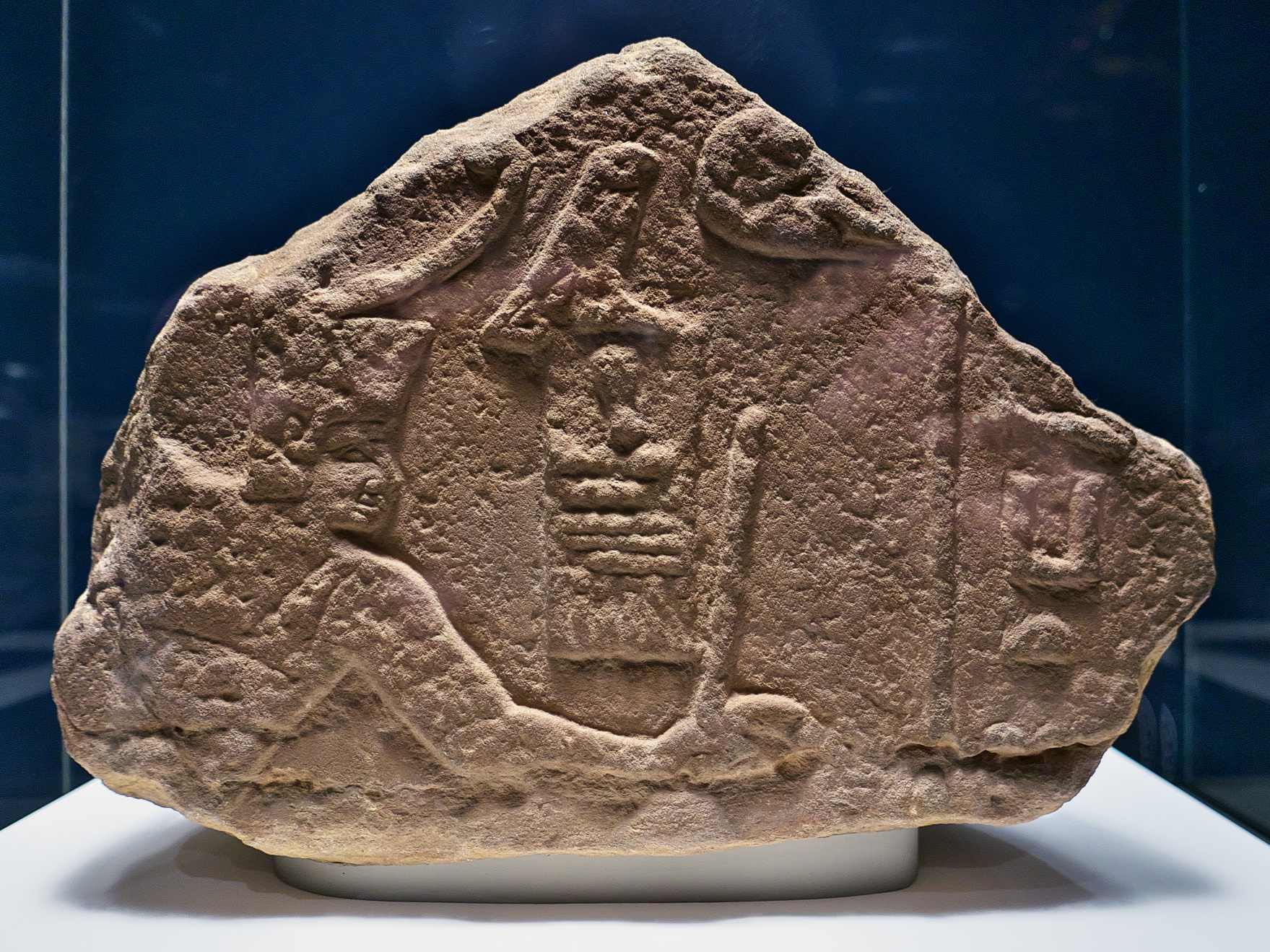 Relief fragment of Sanakht in the pose of smiting an enemy. Originally from the Sinai, now EA 691 on display at the British Museum.
