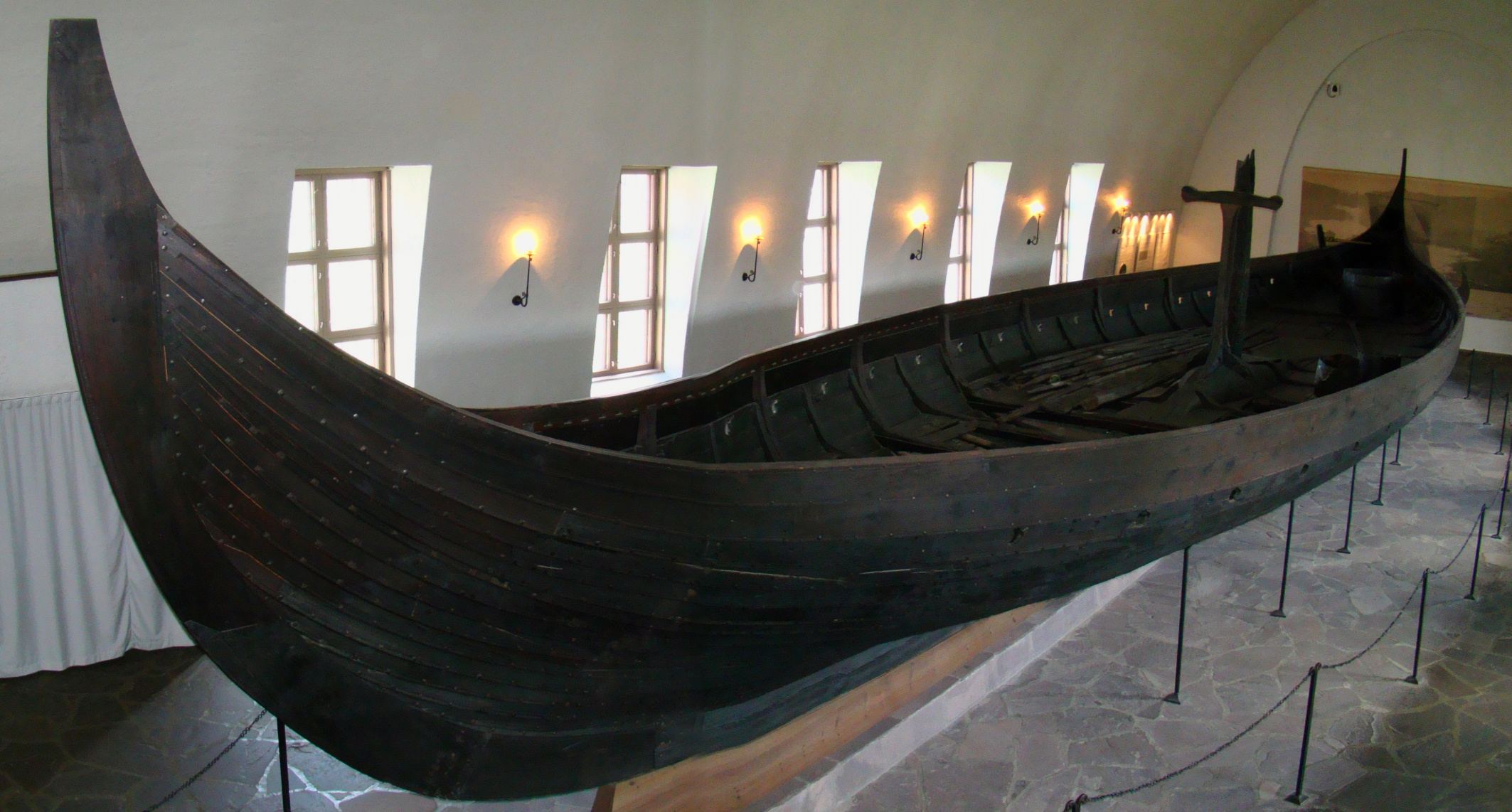 The Gokstad Ship in the purpose-built Viking Ship Museum in Oslo, Norway. The ship is 24 meters long and 5 metres wide, and has room for 32 men with oars to row.