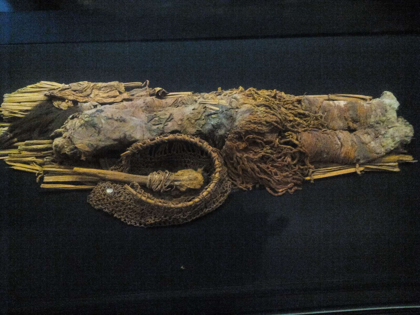 Infant remains preserved with the Red Mummy technique.