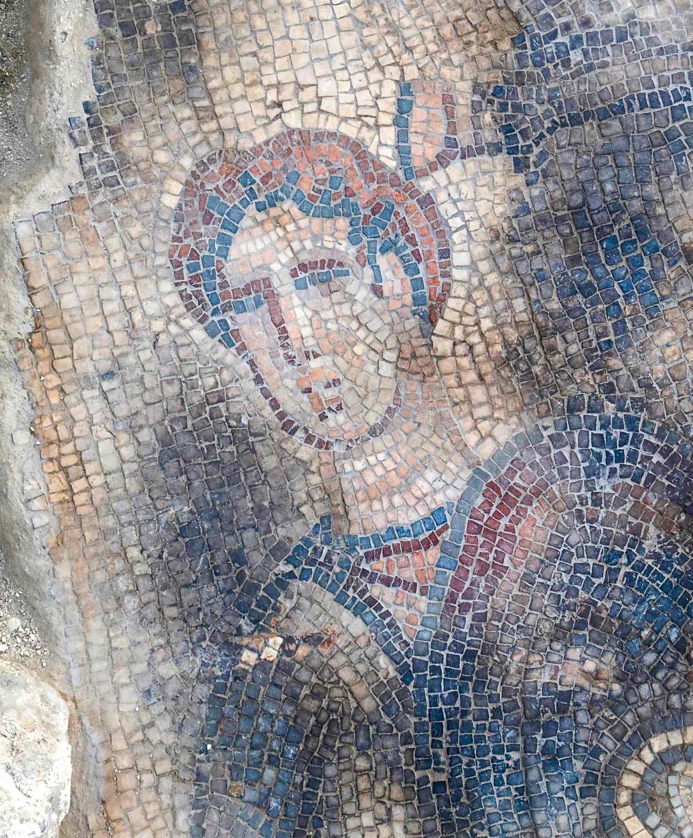 Dead philistine soldier, detail from the Samson carrying the gate of Gaza mosaic, Huqoq synagogue, June 2023.