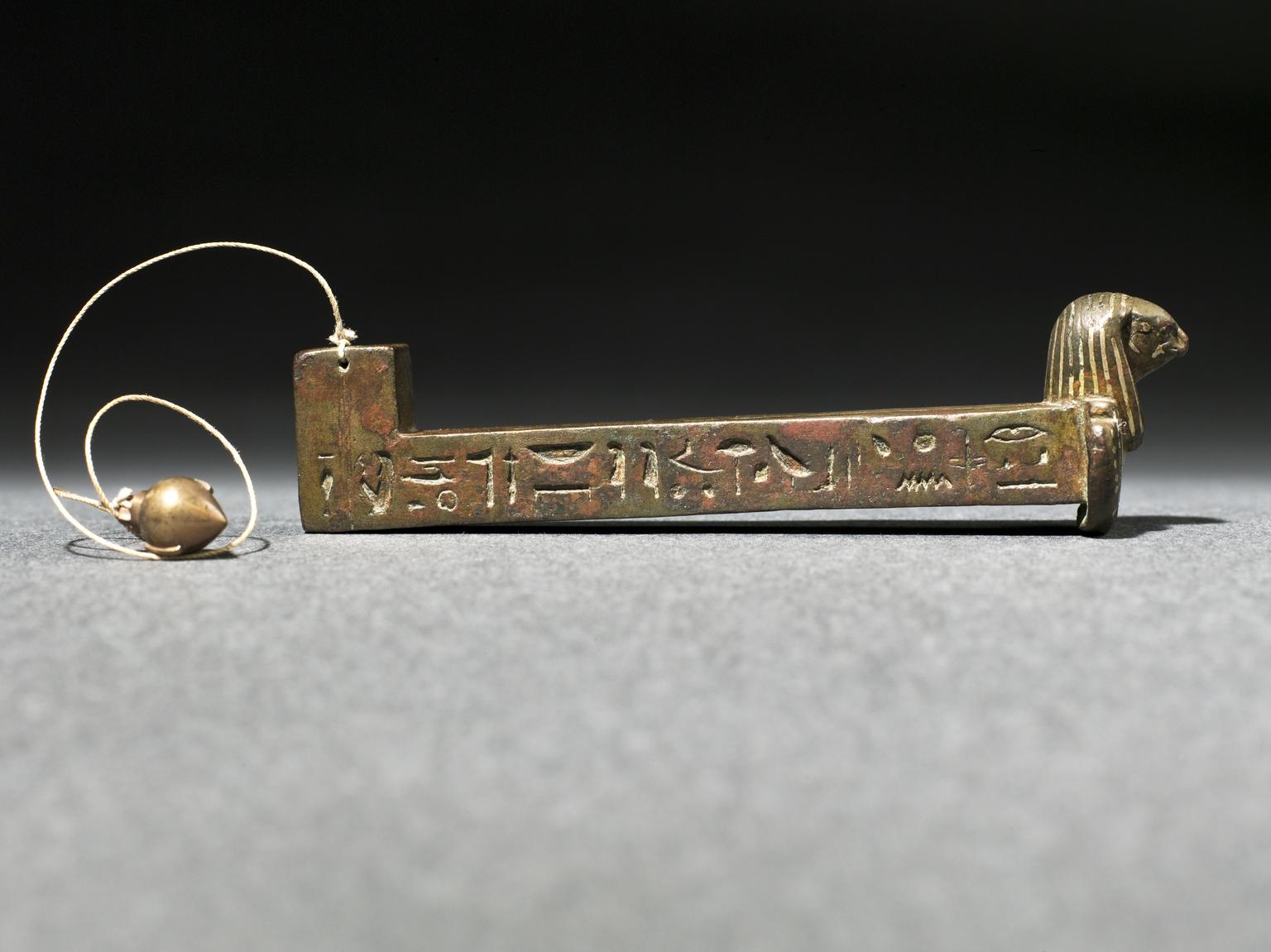 'Merkhet', Ancient Egyptian astronomical timekeeping instrument, bronze with hieroglyphic text inlaid with electum metal, fitted with replica plub bob, 600BCE.